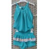 top turquesa y short mariposas